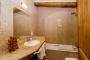 Bathroom with tub and shower over